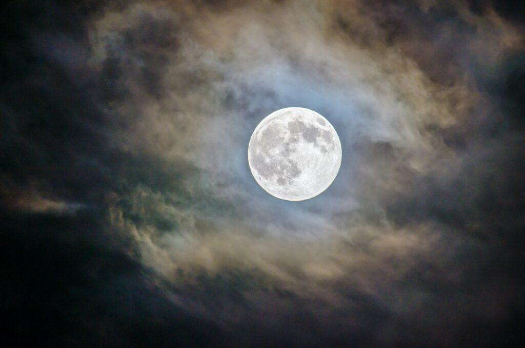 full moon and gray clouds during nighttime 